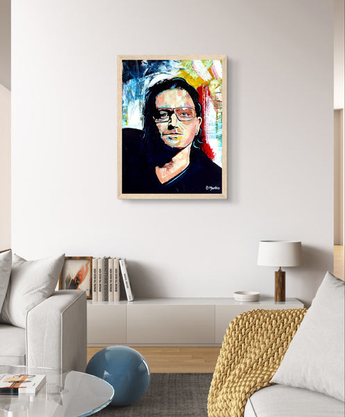 Framed wall art print of Bono from U2 by Irish artist Ó Maoláin. This vibrant, colorful portrait captures Bono's legendary stage presence, adding a dynamic rock 'n' roll flair to your decor. A must-have for U2 fans, blending music and art seamlessly.