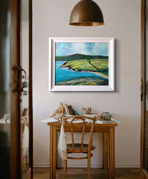 Acrylic painting on canvas titled 'Cushendun Vista' by Ó Maoláin, depicting the tranquil village of Cushendun with Glenariff in the distance, framed in white.