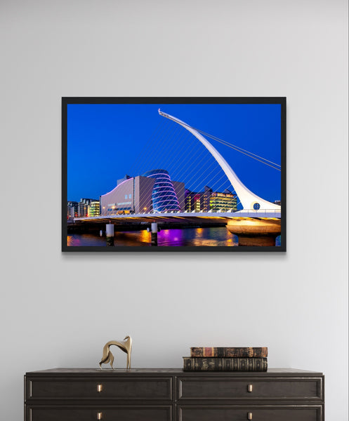 Nighttime skyline of Dublin featuring Samuel Beckett Bridge & Convention Centre reflected in River Liffey, framed art print.