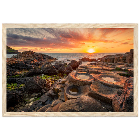 The framed design adds a touch of sophistication, making it a perfect addition to your home or office decor. Immerse yourself in the tranquility of this coastal landscape every day with our Sunset at Giant's Causeway framed art print