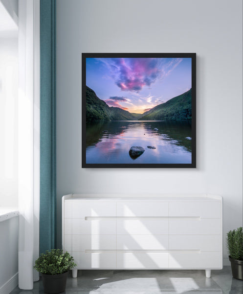 Framed wall art print of Glendalough's Upper Lake at dusk in County Wicklow. The serene scene features a perfect reflection of the sky in the lake's calm water, surrounded by lush greenery, capturing the tranquil beauty of Ireland's iconic landscape.