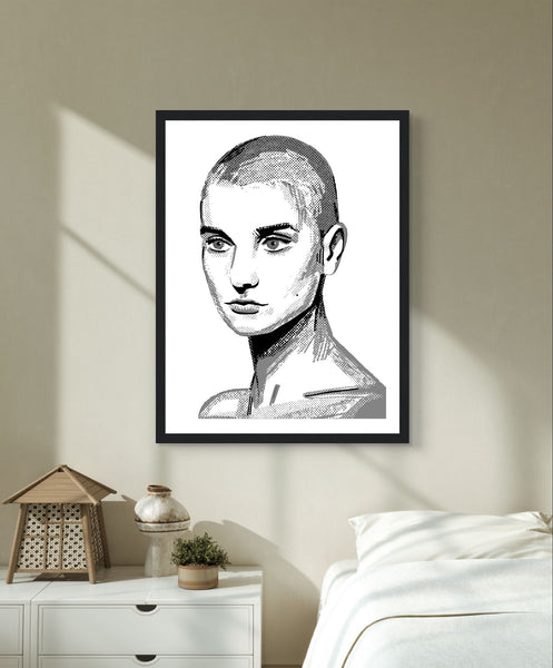 Framed wall art print of Sinéad O'Connor features a high-quality portrait capturing the iconic singer's striking presence. This vintage music framed wall art showcases the Irish princess and pop star, perfect for retro posters enthusiasts. Ideal for fans of musician prints.