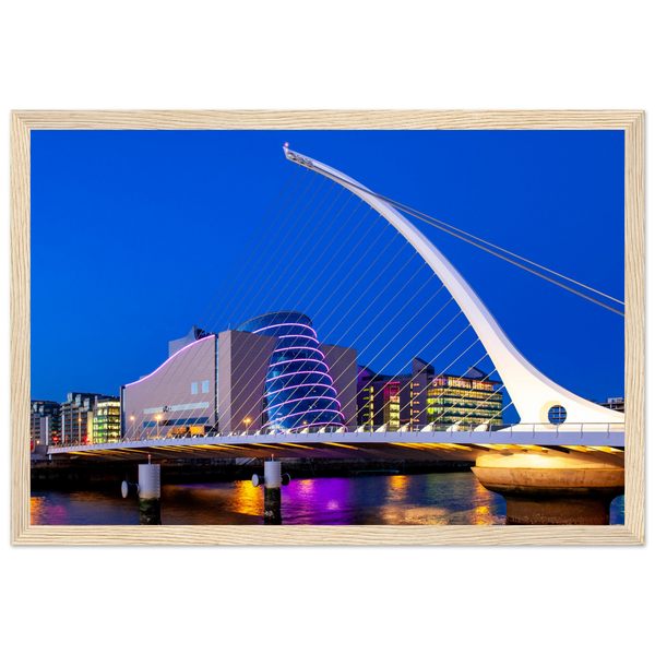 Enchanting Dublin skyline at night: Samuel Beckett Bridge & Convention Centre lights reflected on River Liffey. Framed art print captures city's magic.